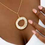 Baguette-Diamond-Necklace-with-a-Fluid-Sphere-Pendant-sparkling