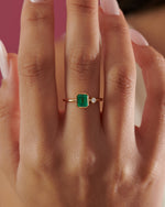 Emerald-Engagement-Ring-with-A-Small-Diamond-symmetric-Emerald-Ring-top-shot