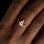Floating-Pear-Cut-Diamond-Engagement-Ring-in-a-Classic-Style-sparking