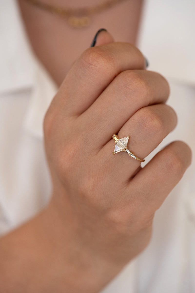 Geometric Engagement Ring with Triangle and Baguette Diamonds on Hand top angle 