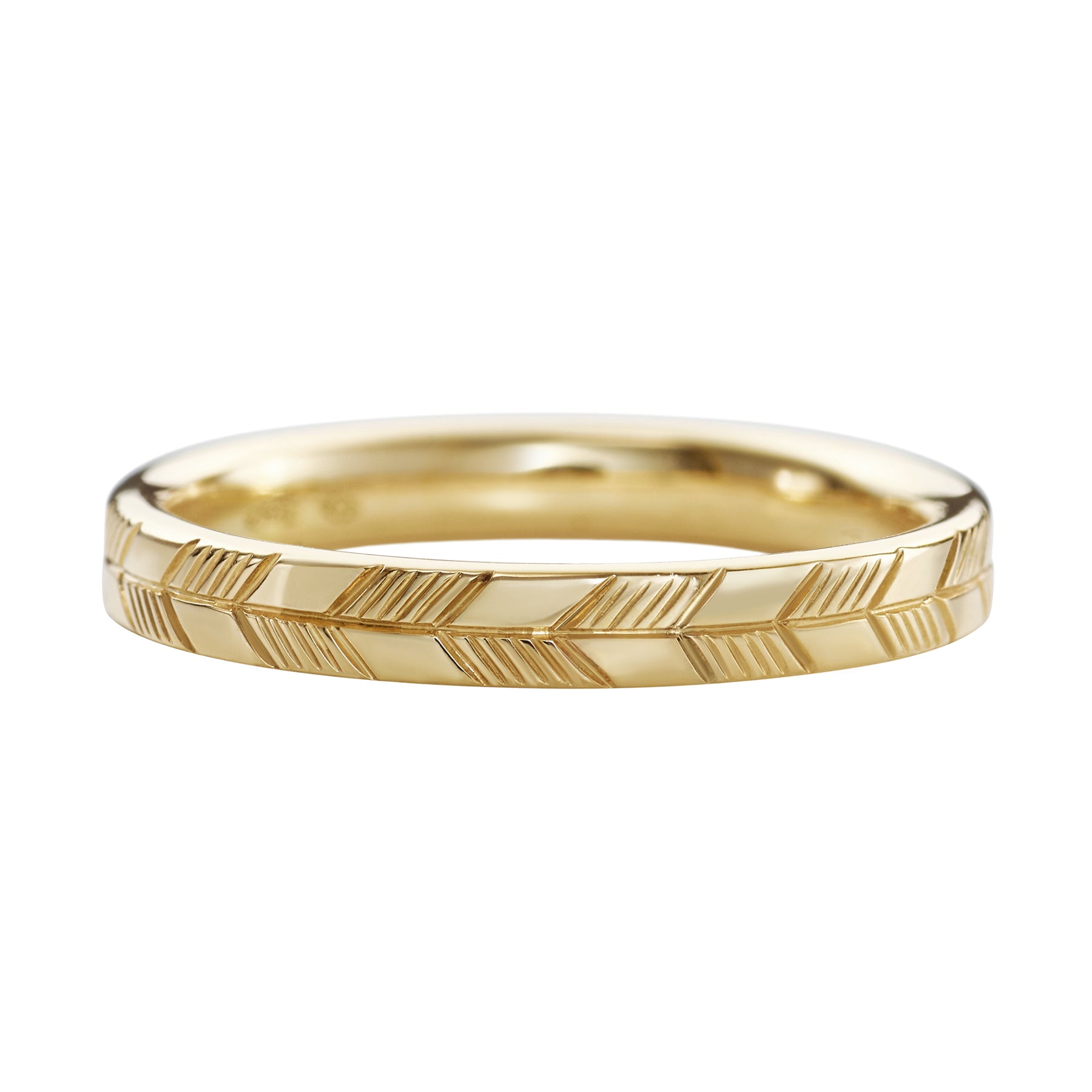 Golden-Wedding-Band-with-an-Abstract-Feather-Engraving-CLOSEUP