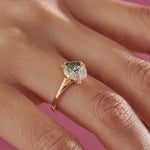 Serene-Trillion-Teal-Sapphire-and-Marquise-Diamond-Engagement-Ring-side-shot