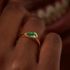 Solitaire-Engagement-Ring-with-a-Pear-Cut-Emerald-side-shot