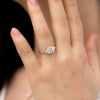 Step-Cut-Engagement-Ring-with-Eight-Square-Diamonds-on-finger