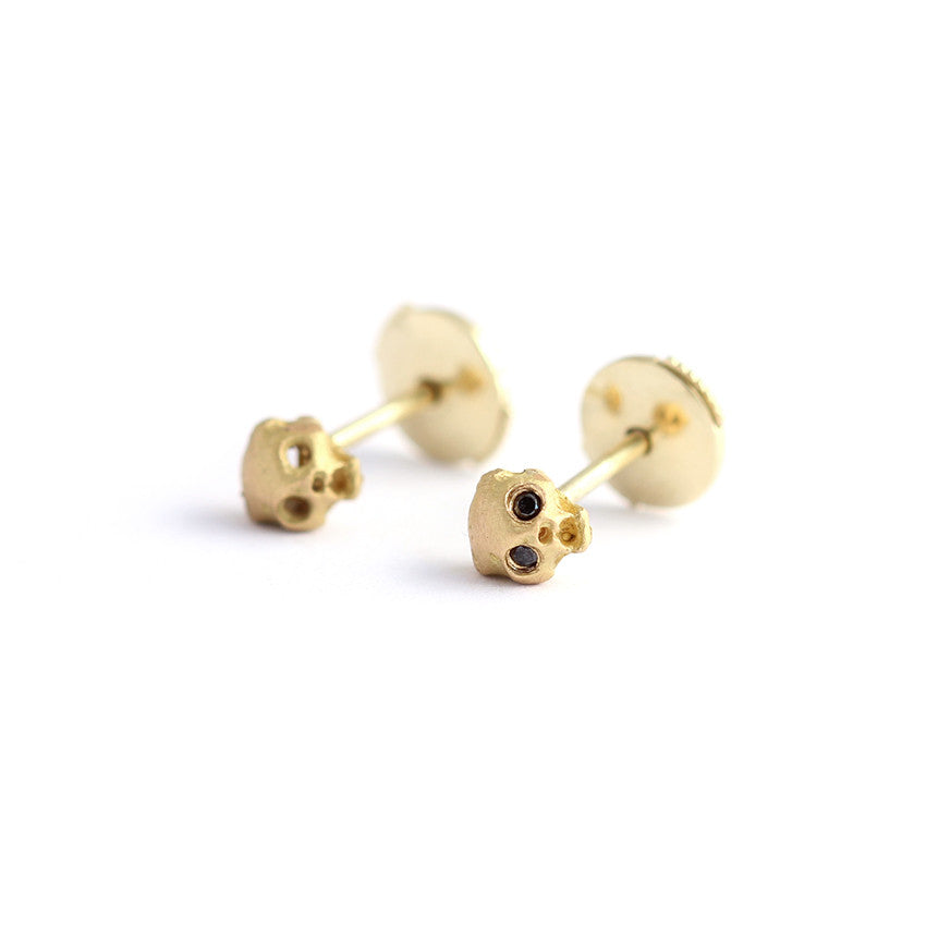 Gold skull earrings