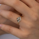Aquamarine-Engagement-Ring-Aquamarine-And-Diamond-Cluster-Ring-on-finger