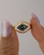 Aurora-Lozenge-Cut-Parti-Sapphire-_-Diamond-Ring-Holding_48976ee4-0114-47cc-a33f-bee273a94253