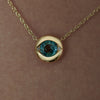 Ayin-Teal-Sapphire-Diamond-Accent-Evil-Eye-Necklace-on-neck