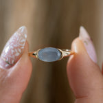 Blue-Mist-East---West-Oval-Milky-Sapphire-Ring-Holding