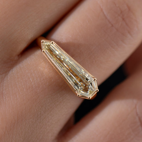Elongated-Shield-Cut-Diamond-Solitaire-Ring-with-PaveDetailing-Closeup