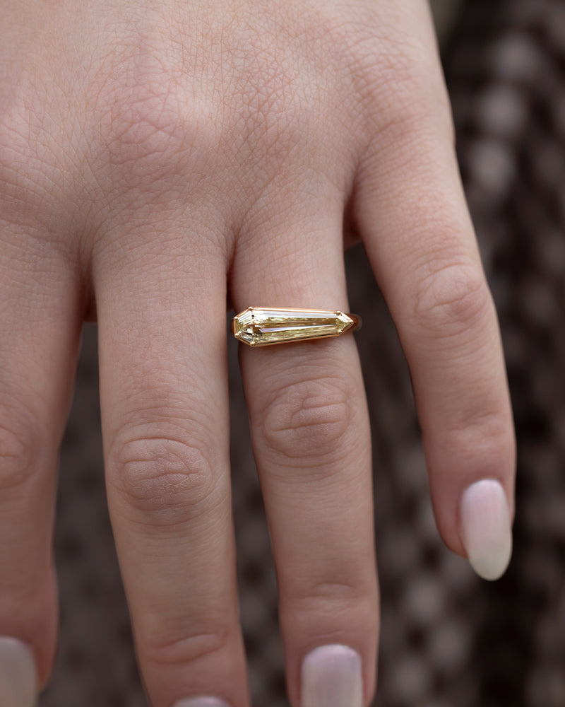 Elongated-Shield-Cut-Diamond-Solitaire-Ring-with-PaveDetailing-Hand