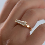 Elongated-Shield-Cut-Diamond-Solitaire-Ring-with-PaveDetailing-On-Hand-Angle