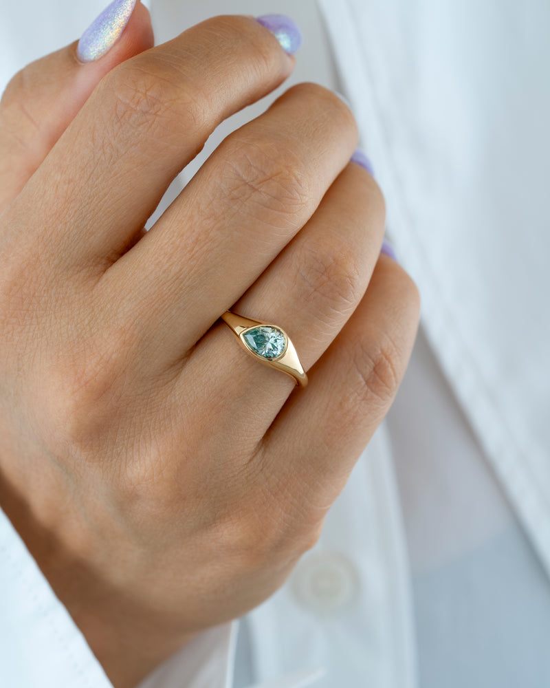 Glacier-Light-Blue-Moissanite-Solitaire-Ring-Hand-Midshot_700e372f-cb88-40ed-908c-c91bf5c17c48