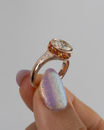Hathi-Old-European-Cut-Diamond-_-Padparadscha-Engagement-Ring-Side-Angle-Holding_6005f0df-936d-4b65-9cf0-b4f42dfff4fd