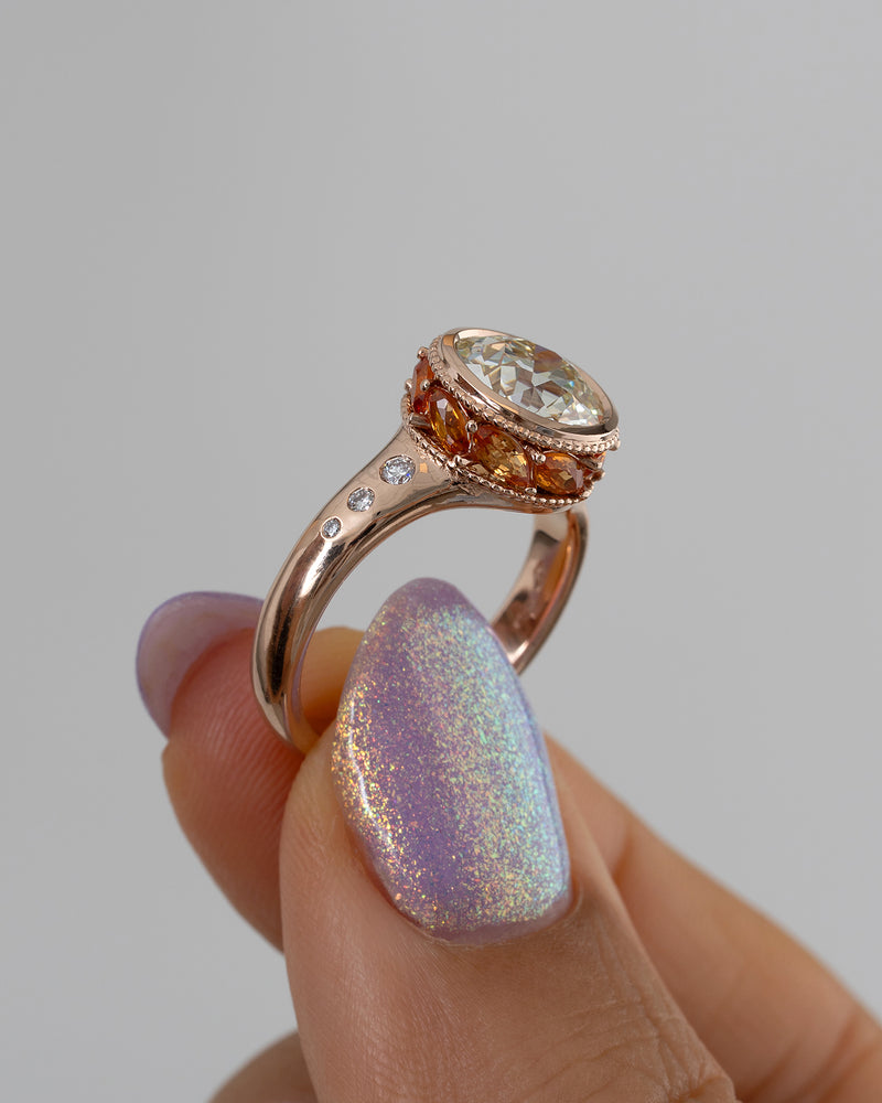 Hathi-Old-European-Cut-Diamond-_-Padparadscha-Engagement-Ring-Side-Angle-Holding_6005f0df-936d-4b65-9cf0-b4f42dfff4fd