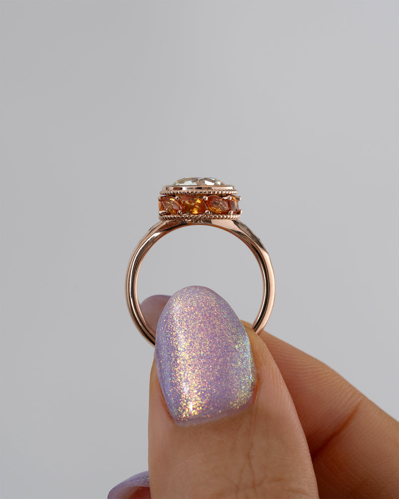 Hathi-Old-European-Cut-Diamond-_-Padparadscha-Engagement-Ring-Side-Holding_34f19375-d3b2-44c5-b40c-46f6e7812dd3