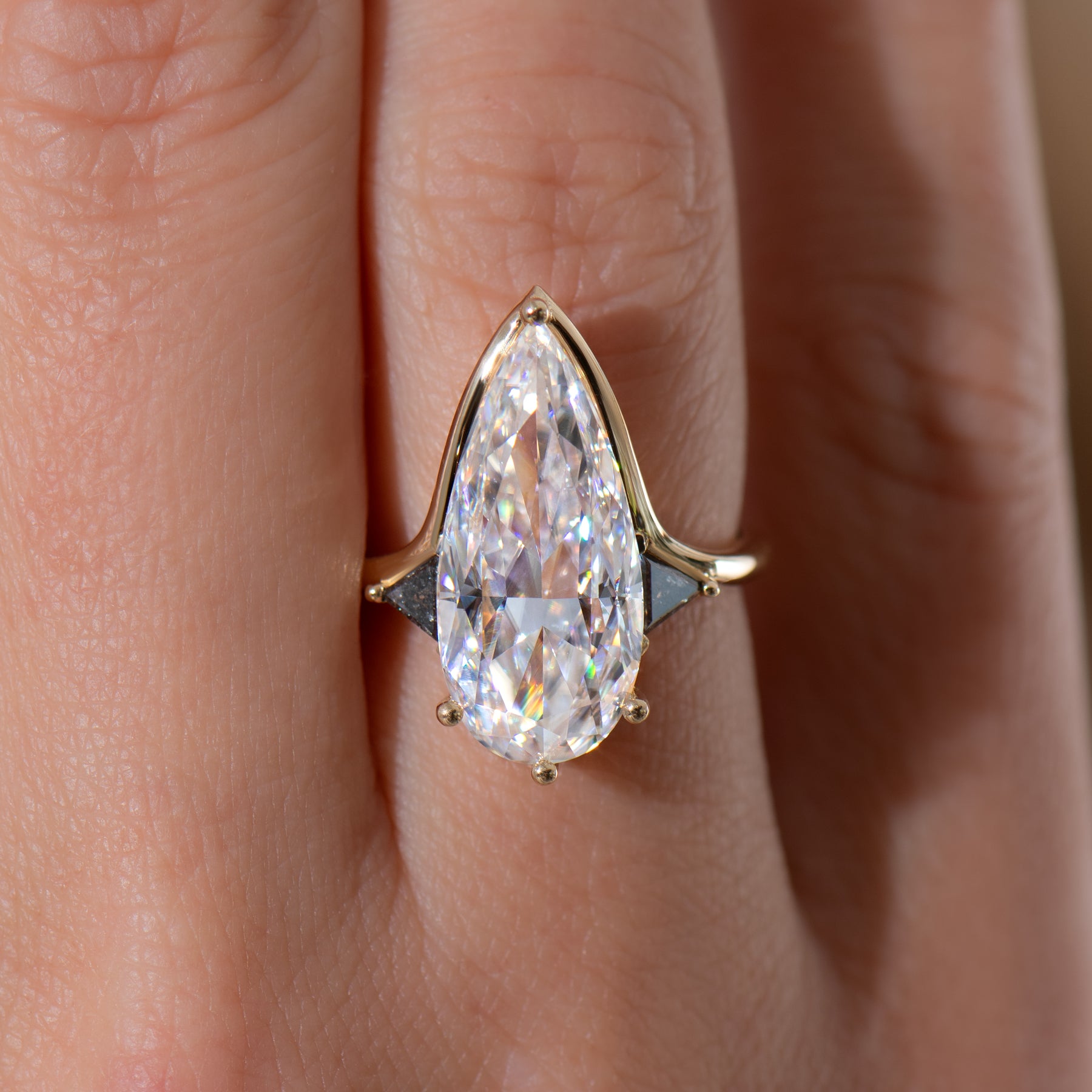 Interstellar-5ct-Moissanite-Engagement-Ring-in-Elongated-Pear-Shape-Closeup_8fd6a45a-fa98-42e5-b817-60c12fd2470b