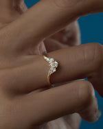Pear-Brilliant-Diamond-Crown-Nesting-Wedding-Ring-on-finger