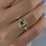 Piet-Fancy-Emerald-Cut-Diamond-Ring-with-Teal---White-Diamond-Halo-Closeup