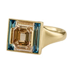 Piet-Fancy-Emerald-Cut-Diamond-Ring-with-Teal-_-White-Diamond-Halo-Packshot-Side_6be296ad-1c32-4b97-b96c-4b3ca10b9b6d