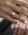 Rectangular-Step-Cut-Diamond-Engagement-Ring-on-finger