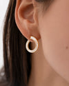 Spiral-Hoop-Earrings-with-Tapered-Baguette-Diamonds-Angle_5f6a2187-e0e6-41ec-9731-038e7952a063