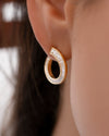 Spiral-Hoop-Earrings-with-Tapered-Baguette-Diamonds-Side_908f3478-afbe-42bb-a54d-17557453a6ef