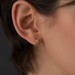 Teal-Baguette-Sapphire-Huggie-Earrings-On-Ear