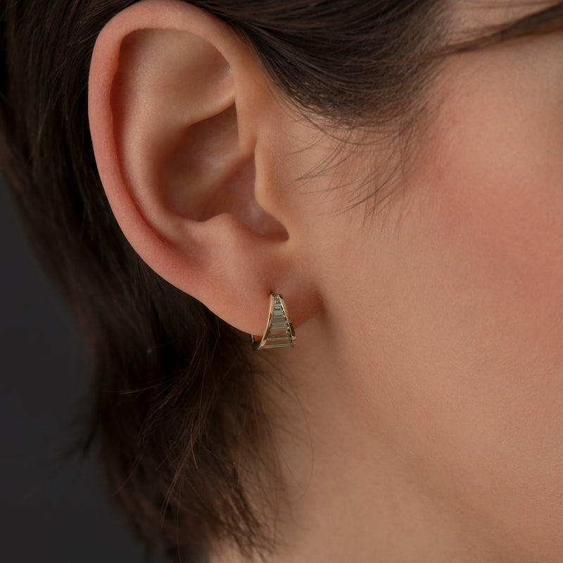 Teal-Baguette-Sapphire-Huggie-Earrings-On-Ear