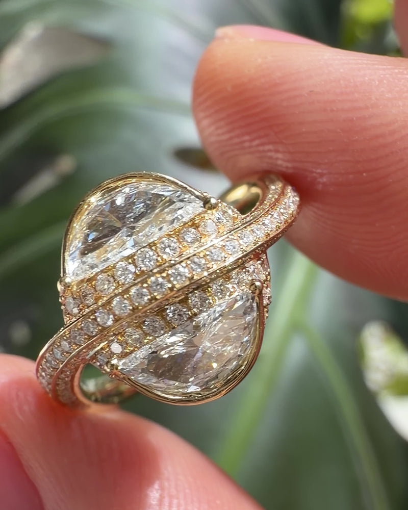 Half_Moon_Diamond_Crossover_Engagement_Ring_Holding_Video
