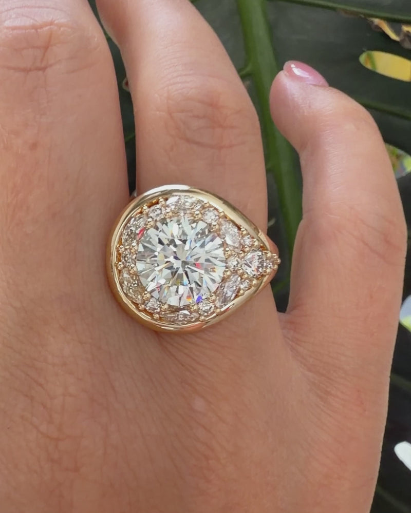 Gold_Halo_Engagement_Ring_with_a_Lassoed_4_Carat_Diamond_Video

