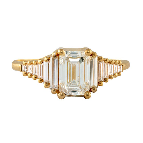 classic Emerald-cut engagement ring with tapered needle baguette diamonds