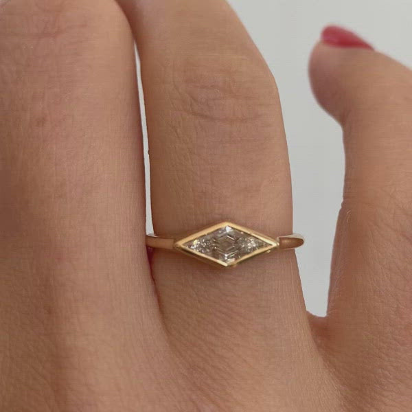 Lozenge-Cut-Diamond-Ring-with-a-Golden-Bezel-closeup