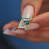 Aquatic-Trillion-Diamond-and-Teal-Sapphire-Engagement-Ring-sparking