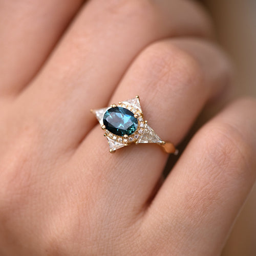 Teal Sapphire Deco Ring with Triangle Diamonds on finger.jpg