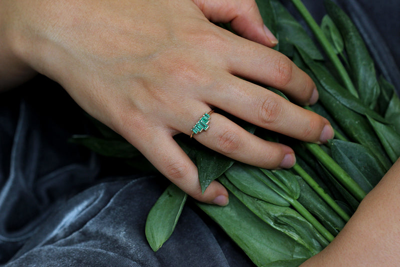 Baguette Cut Emeralds Engagement Ring On Ring Finger