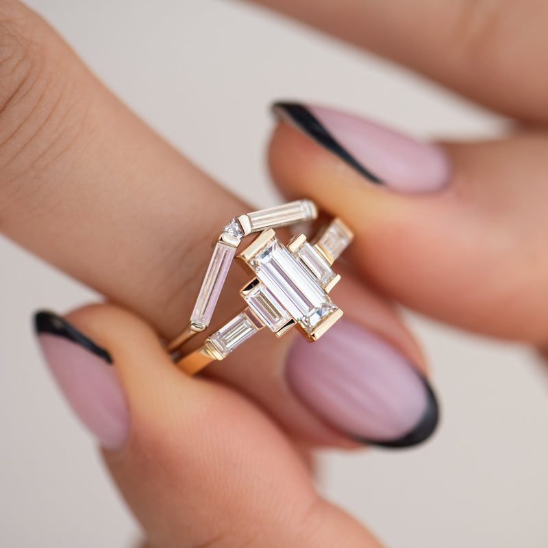 Baguette-Diamond-Engagement-Ring-with-Golden-Framework-moment