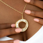 Baguette-Diamond-Necklace-with-a-Fluid-Sphere-Pendant-glistening.jpg