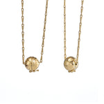 Baguette-Diamond-Necklace-with-a-Fluid-Sphere-Pendant-gold