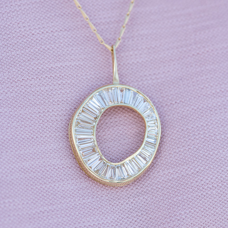 Baguette-Diamond-Necklace-with-a-Fluid-Sphere-Pendant-shiny