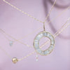 Baguette-Diamond-Necklace-with-a-Fluid-Sphere-Pendant-top-ahot