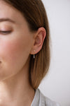 Baguette Diamond Drop Earrings on Ear Front View 