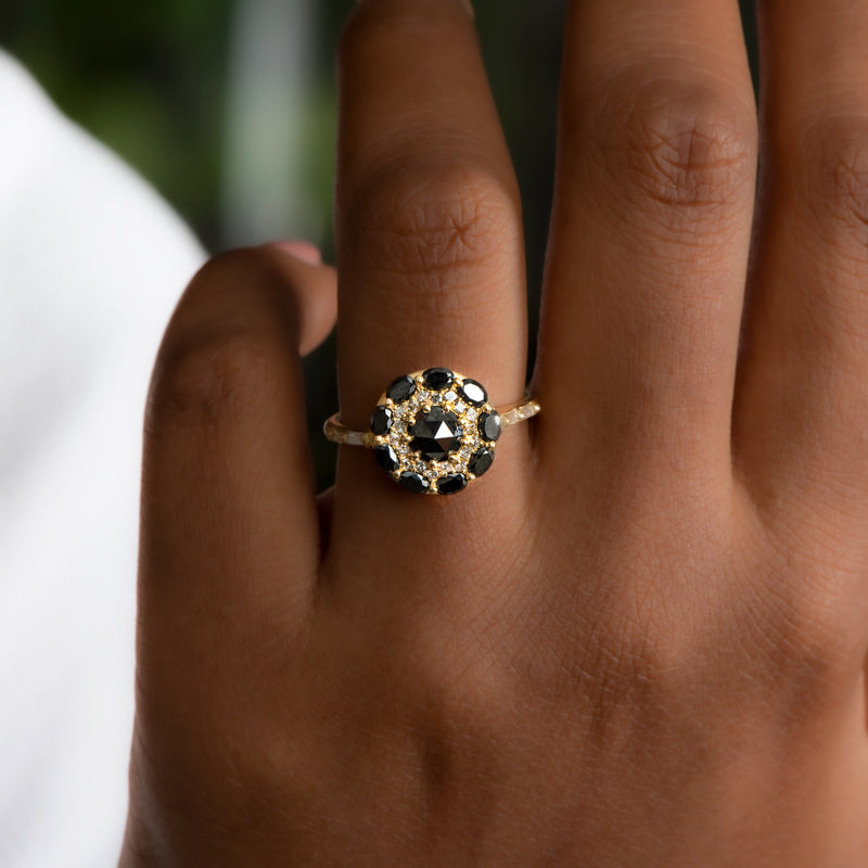 Black-Diamond-Mandala-Engagement-Ring-With-Baguette-Diamond-Band-glistening-