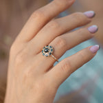 Black-Diamond-Mandala-Engagement-Ring-With-Baguette-Diamond-Band-side-shot-on-finger.
