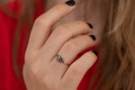 Black Diamond Flora Engagement Ring on Hand Side Angle 
