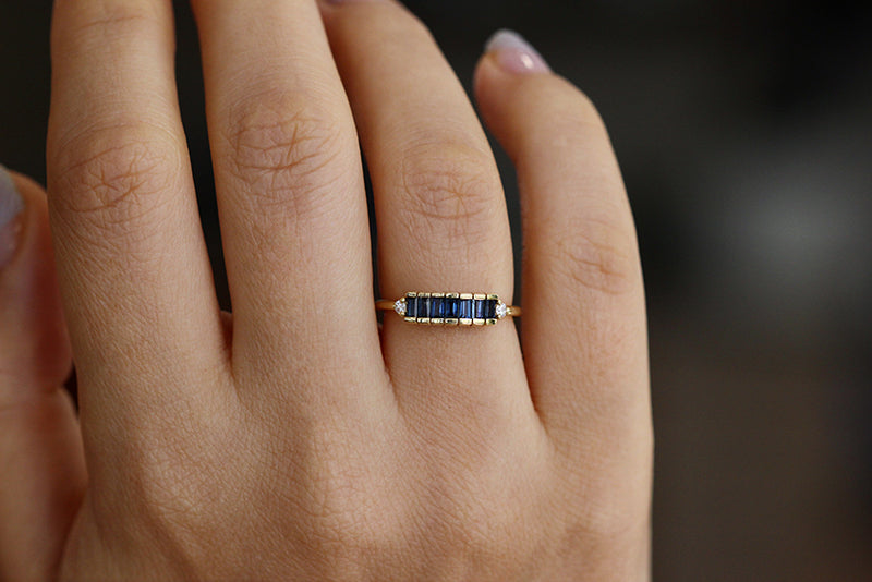 Blue Sapphire Baguette Engagement Ring On Finger