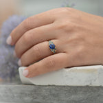Blue-and-Teal-Sapphire-Cluster-Ring-in-finger