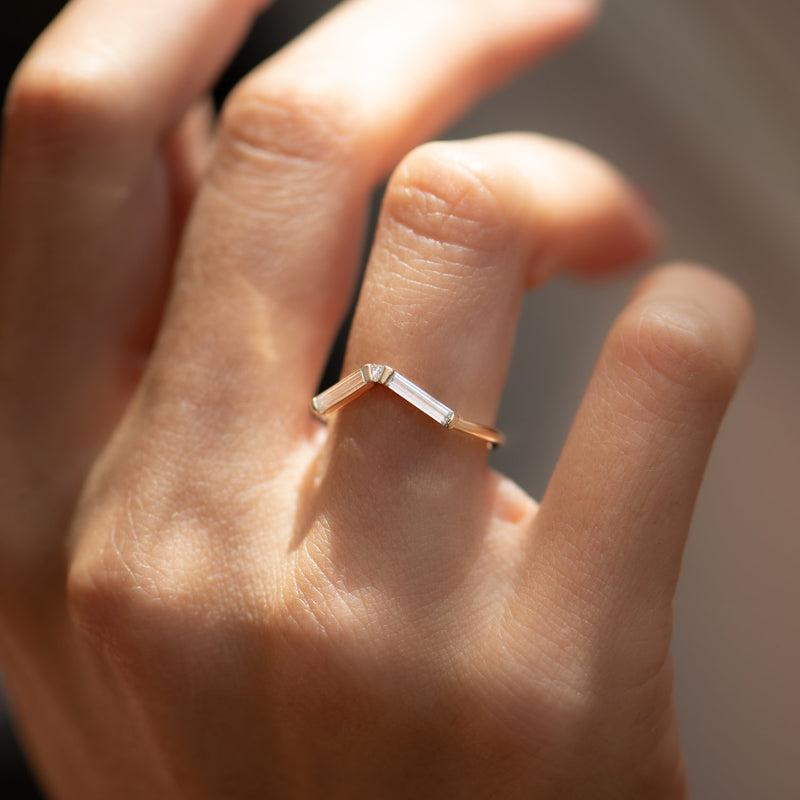 Chevron-Baguette-Diamond-Wedding-Ring-side-shot-on-finger