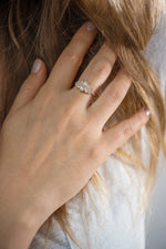 Cluster Engagement Ring with Round Diamonds on Hand 