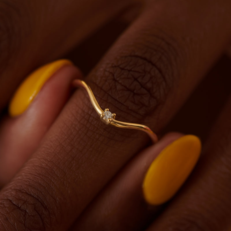 Curved-Golden-Band-Embellished-with-a-Brilliant-Diamond-SIDE-SHOT
